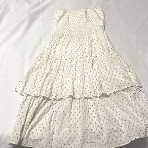 Strapless beige dress with small black print…